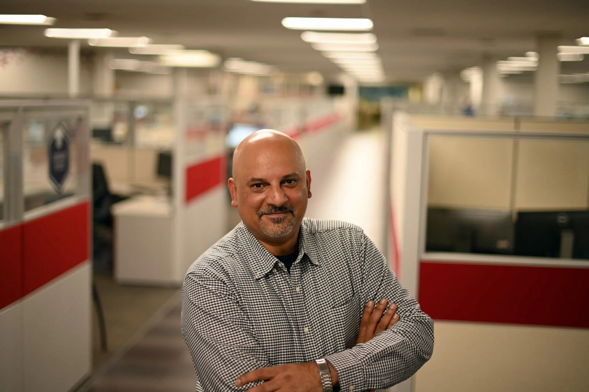 A close up of a happy Milacron employee in our offices.