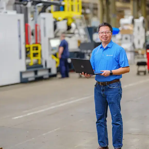 Employee working on computer in a factory